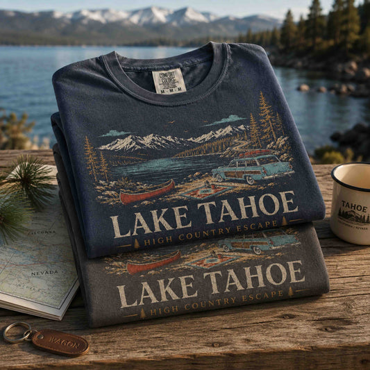 Lake Tahoe High Country Escape graphic tees displayed in a mountain lake setting