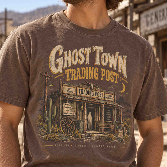 Male model wearing an Espresso Ghost Town Trading Post vintage western graphic tee with denim