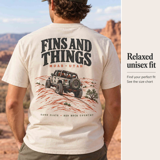 Close-up of the Fins and Things 4x4 back graphic on an Ivory tee, with relaxed-fit and size-chart guidance.