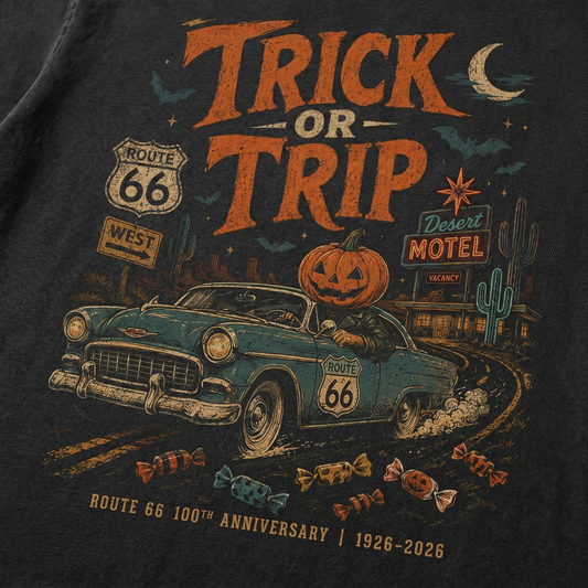 Unisex Halloween Route 66 graphic tee featuring Trick or Trip text, classic car, jack-o-lantern, bats, motel signs, cactus, candy, and vintage distressed road trip artwork.