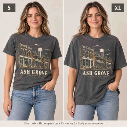 Same woman wearing the Pepper Ash Grove Missouri T-shirt in Small and XL for an illustrative fit comparison.