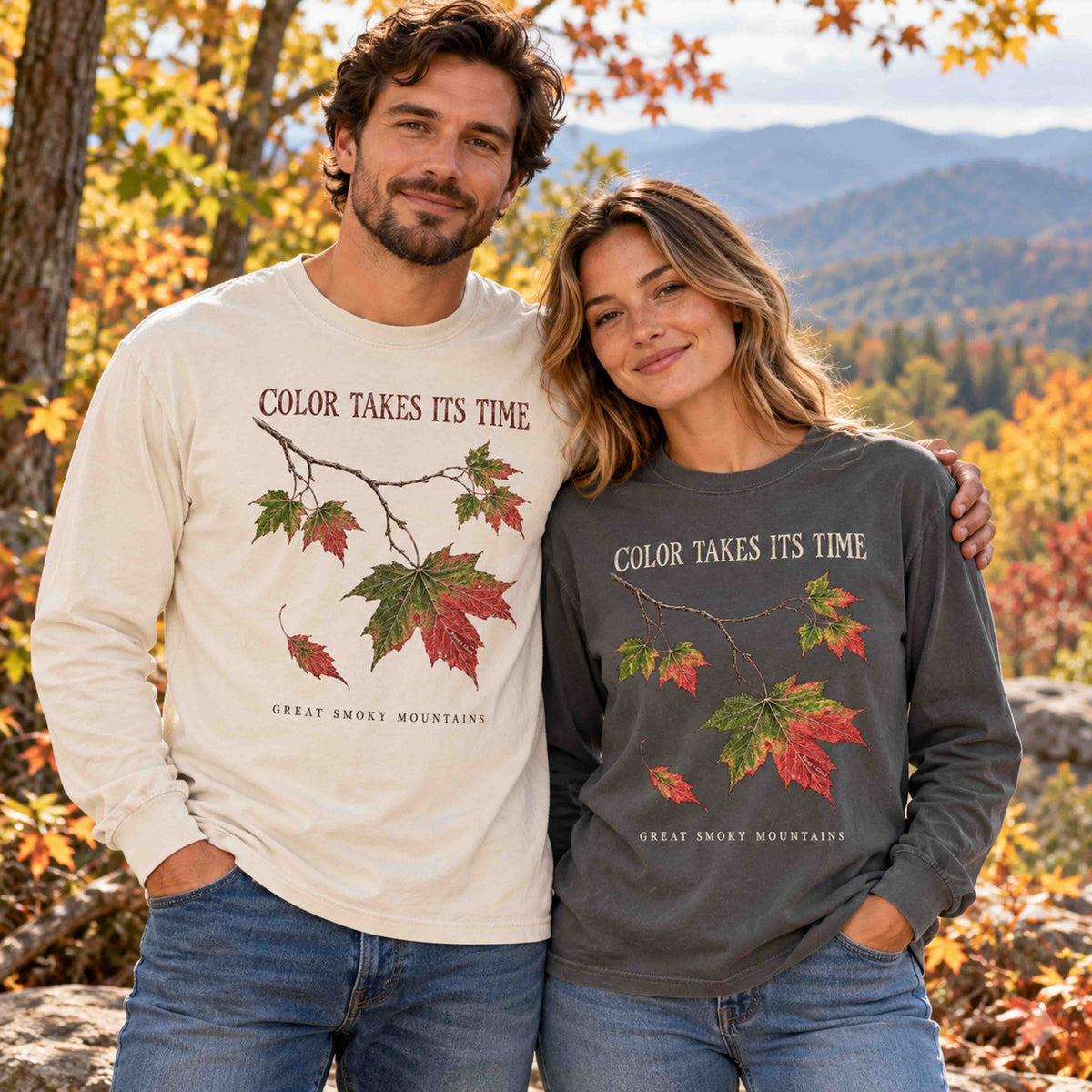 Man and woman wearing Ivory and Pepper Smoky Mountains fall long sleeve shirts.