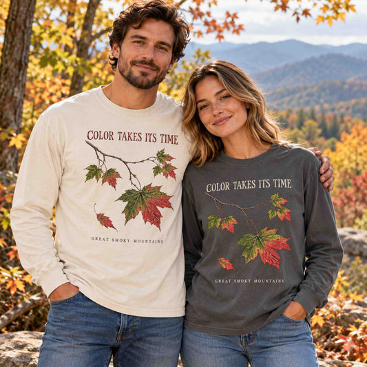 Man and woman wearing Ivory and Pepper Smoky Mountains fall long sleeve shirts.