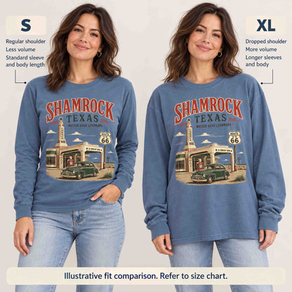 Illustrative S versus XL fit comparison of the Blue Jean Shamrock long sleeve tee on a woman, showing shoulder, sleeve and length differences.