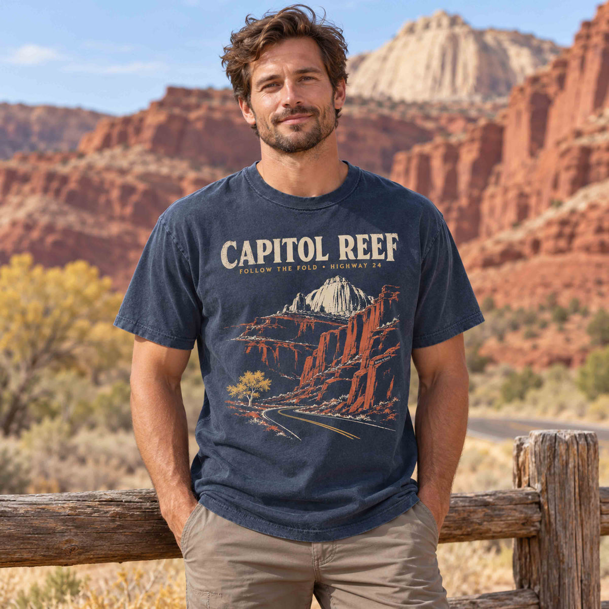 Model wearing a Capitol Reef National Park graphic tee featuring vintage Utah Highway 24 desert scenery.
