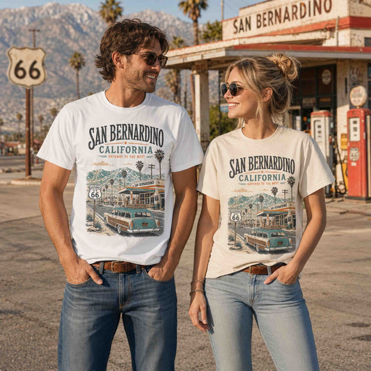Male model wearing white San Bernardino California Route 66 graphic tee on a vintage roadside street