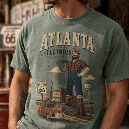 Folded Atlanta Illinois Route 66 Historic Downtown graphic tees in Moss and Yam with vintage roadside styling