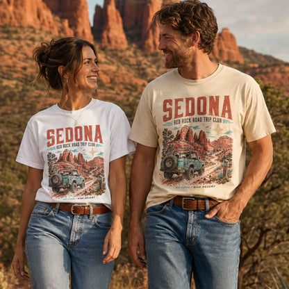 Couple wearing Sedona Arizona Red Rock Road Trip Club graphic tees in a scenic red rock desert setting.