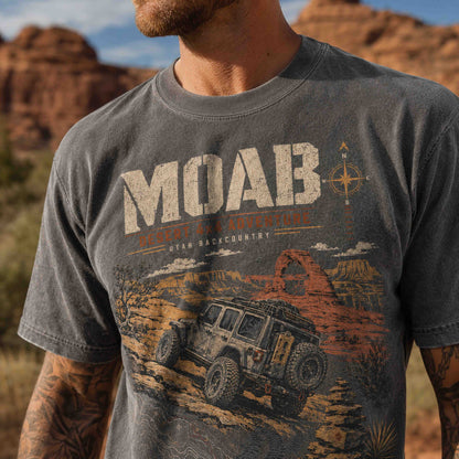 Lifestyle view of Moab Utah Desert 4x4 Adventure graphic tee in an authentic red rock desert setting.