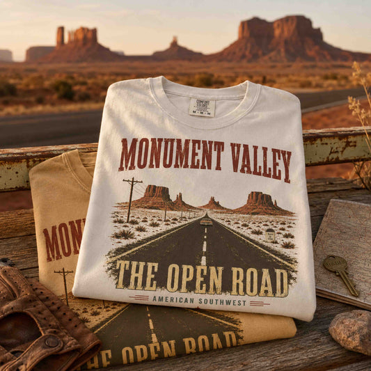 Model wearing ivory Monument Valley desert road trip graphic tee outdoors