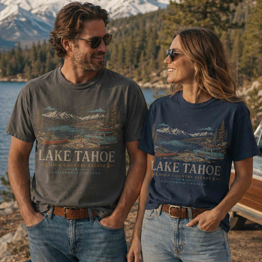 Couple wearing Lake Tahoe High Country Escape graphic tees outdoors by the lake