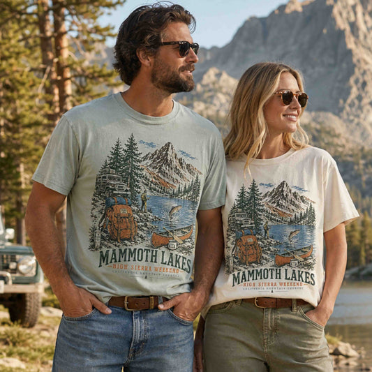 Couple wearing Mammoth Lakes California High Sierra Weekend graphic tees in a scenic mountain setting