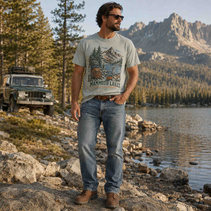 Woman wearing Mammoth Lakes California High Sierra Weekend graphic tee in an alpine landscape
