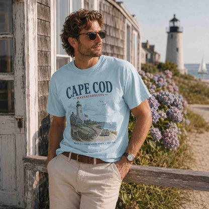 Male model wearing Chambray Cape Cod Massachusetts coastal graphic tee near a lighthouse