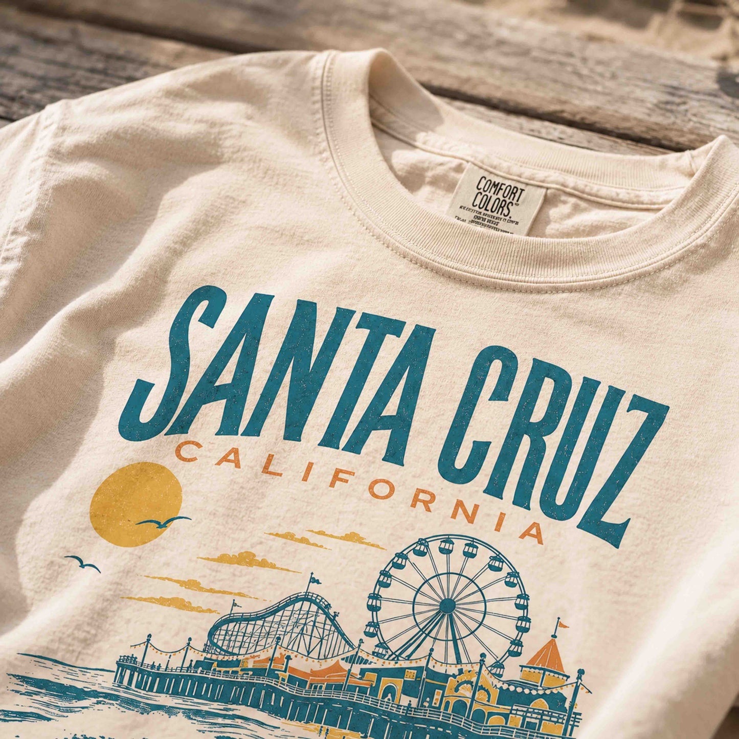 Folded Santa Cruz California graphic tee with vintage coastal artwork