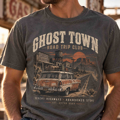 Close-up of a man wearing the charcoal Ghost Town Road Trip Club vintage desert highway graphic tee.