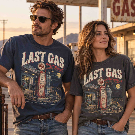Man and woman wearing navy and pepper Last Gas Before Midnight graphic tees with a vintage gas station and red gas pump design.