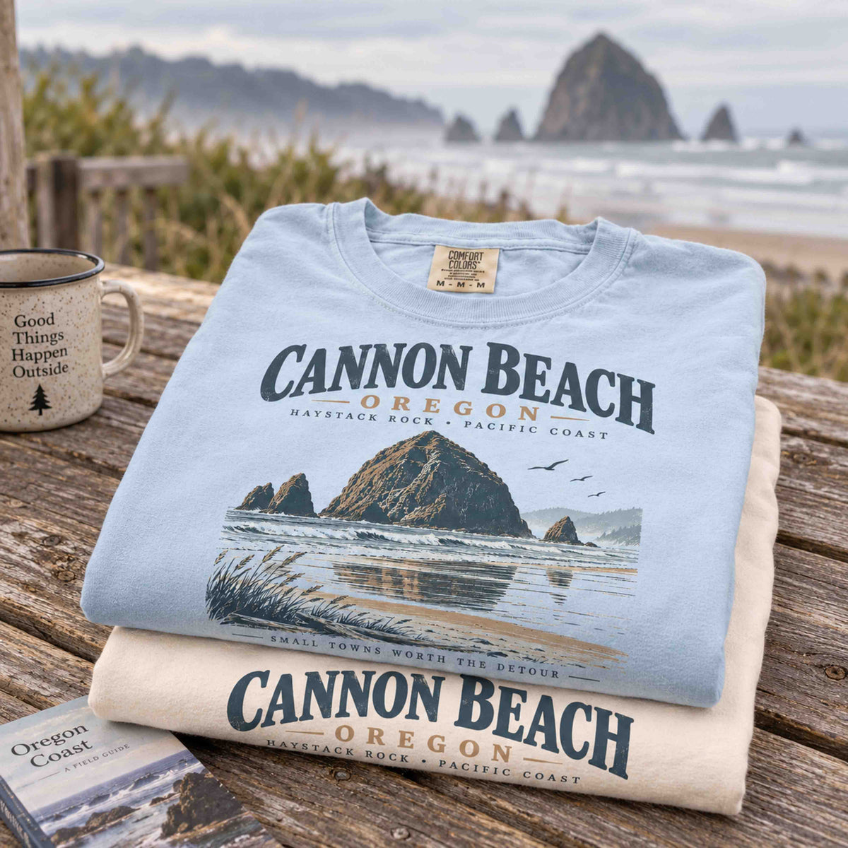 Cannon Beach Oregon Haystack Rock graphic tee in Ivory featuring vintage Oregon Coast shoreline artwork.