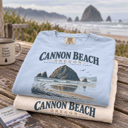 Cannon Beach Oregon Haystack Rock graphic tee in Ivory featuring vintage Oregon Coast shoreline artwork.