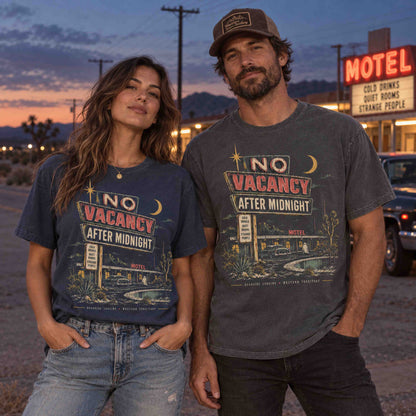 Couple wearing No Vacancy After Midnight vintage motel graphic tees at a desert roadside motel at sunset