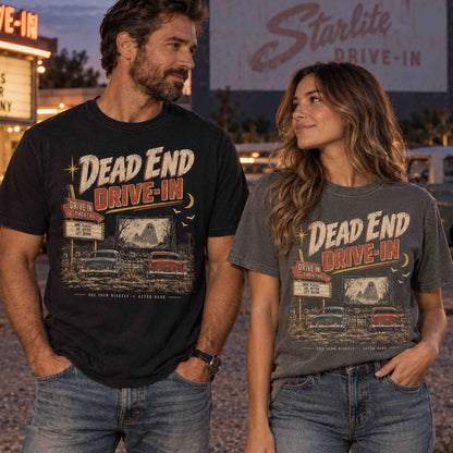 Man and woman wearing Dead End Drive-In vintage haunted Americana graphic tees at a retro drive-in theater