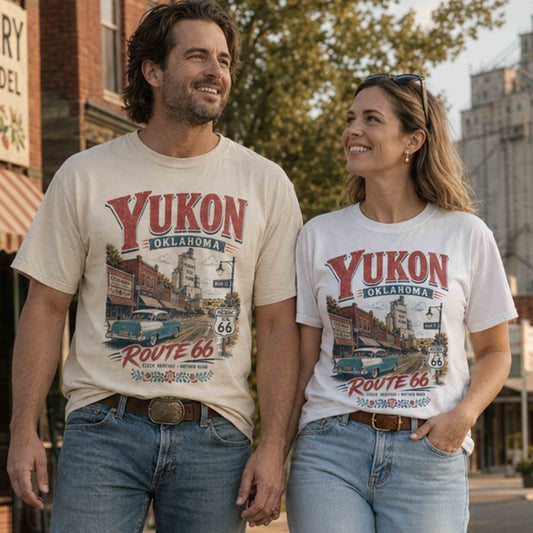 Couple wearing Yukon Oklahoma Route 66 Czech Heritage graphic tees on historic Main Street