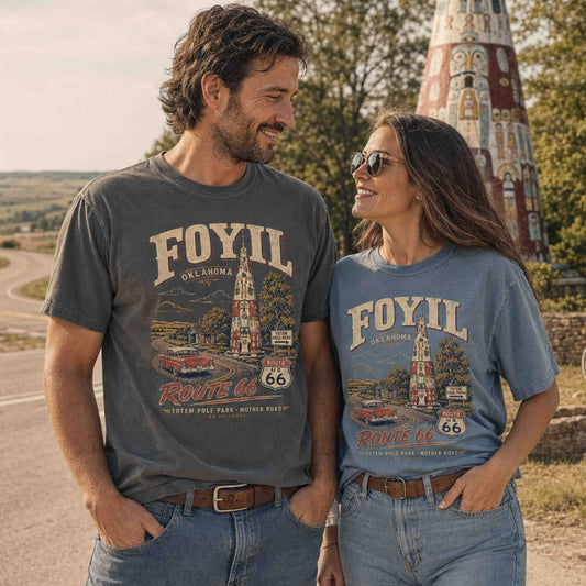 Couple wearing Foyil Oklahoma Route 66 Totem Pole Park graphic tees outdoors