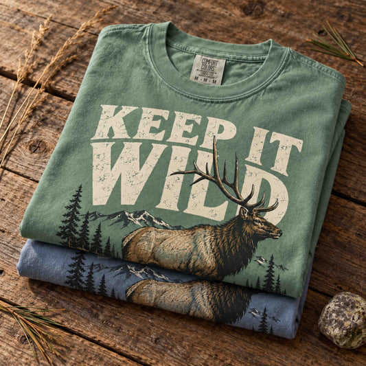 Keep It Wild elk wildlife graphic tee shown in a mountain outdoor lifestyle setting
