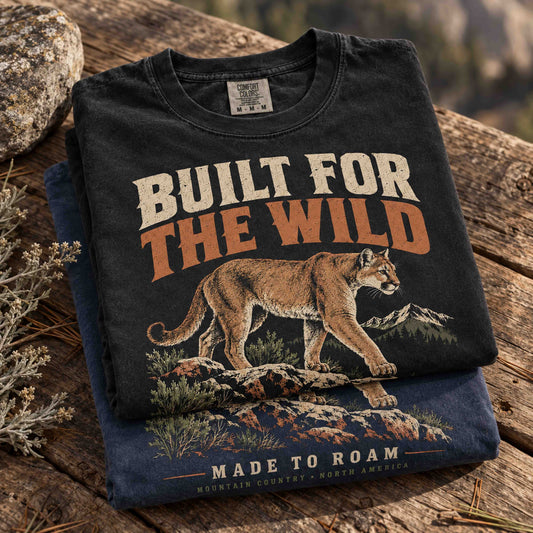 Built for the Wild mountain lion wildlife graphic tee shown in a rugged mountain lifestyle setting