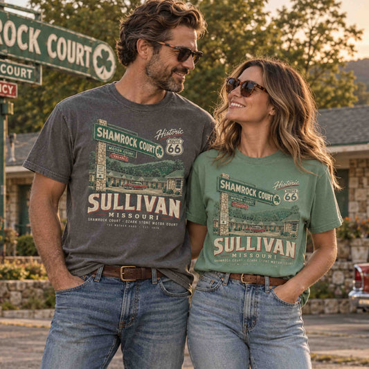 Couple wearing Sullivan Missouri Route 66 Shamrock Court graphic tees outside a vintage motor court.