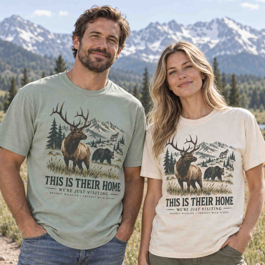 This Is Their Home wildlife graphic tee featuring elk, black bear, mountains, pine trees, and Respect Wildlife message.