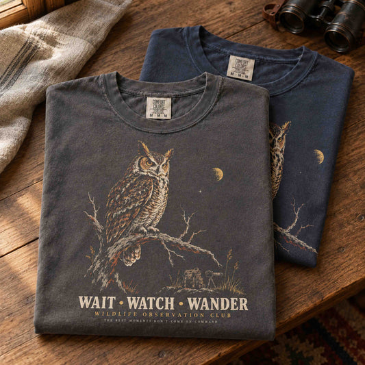 Wait Watch Wander Owl Wildlife Observation graphic tee in Navy featuring a vintage owl, crescent moon, and nature-inspired artwork.