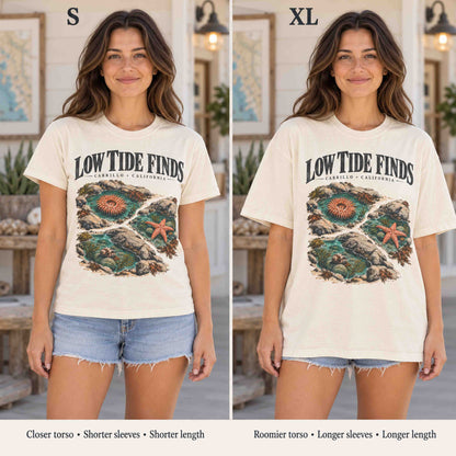 Side-by-side mockup comparing S and XL fits of the Ivory Low Tide Finds tee on the same woman.