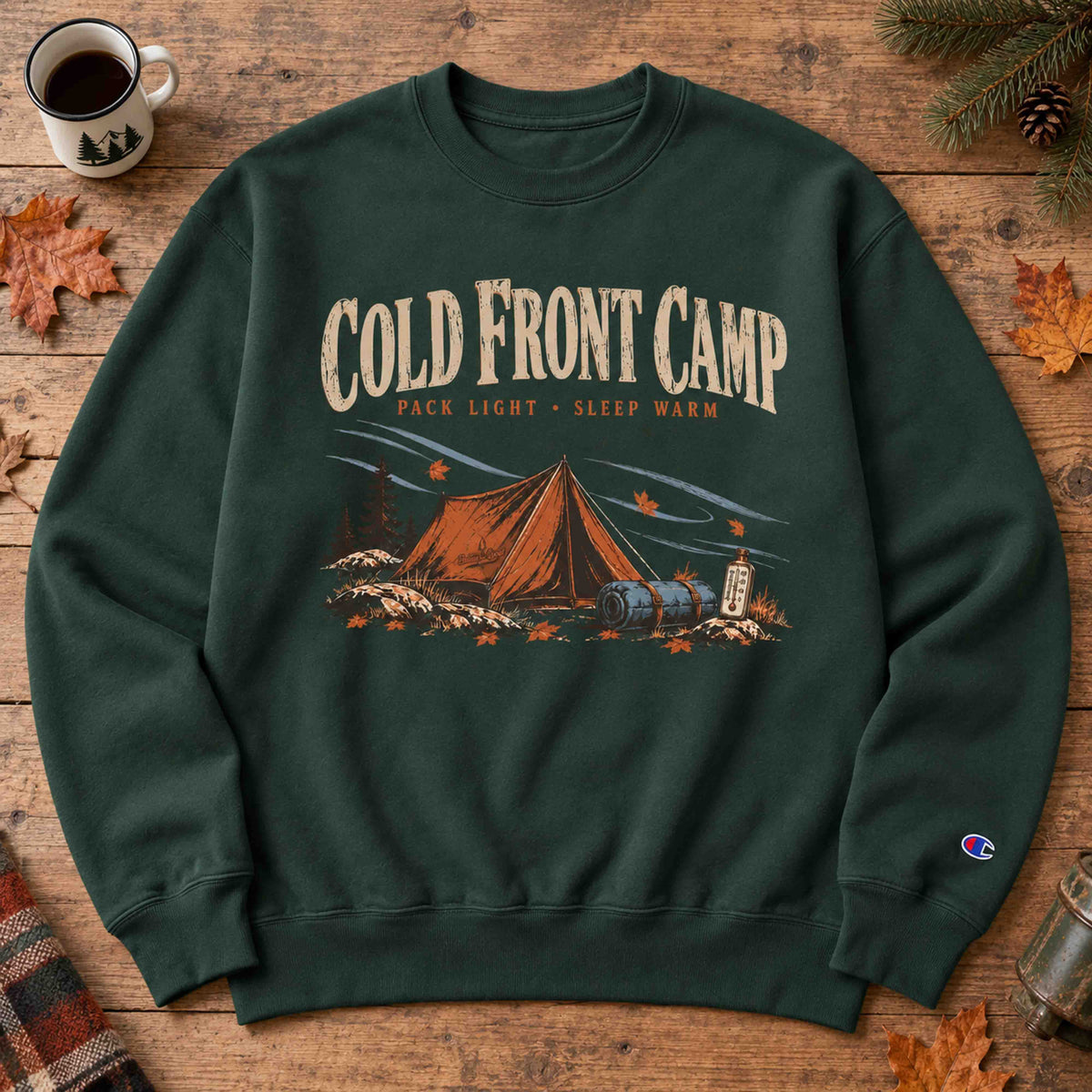 Dark Green Cold Front Camp Champion graphic sweatshirt flat lay with vintage camping artwork