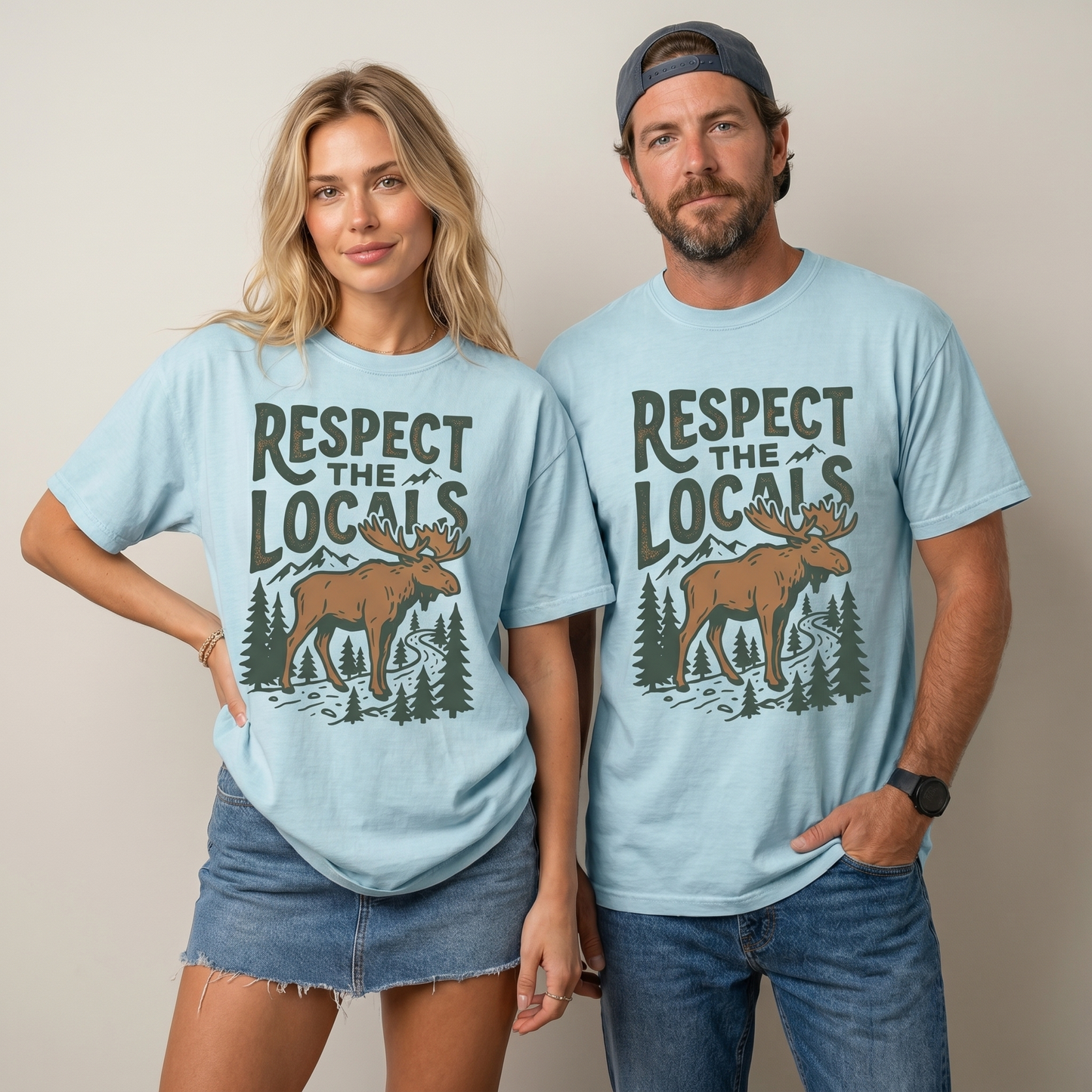Comfort Colors graphic tee featuring a vintage moose, pine trees, mountain artwork, and “Respect The Locals” text.