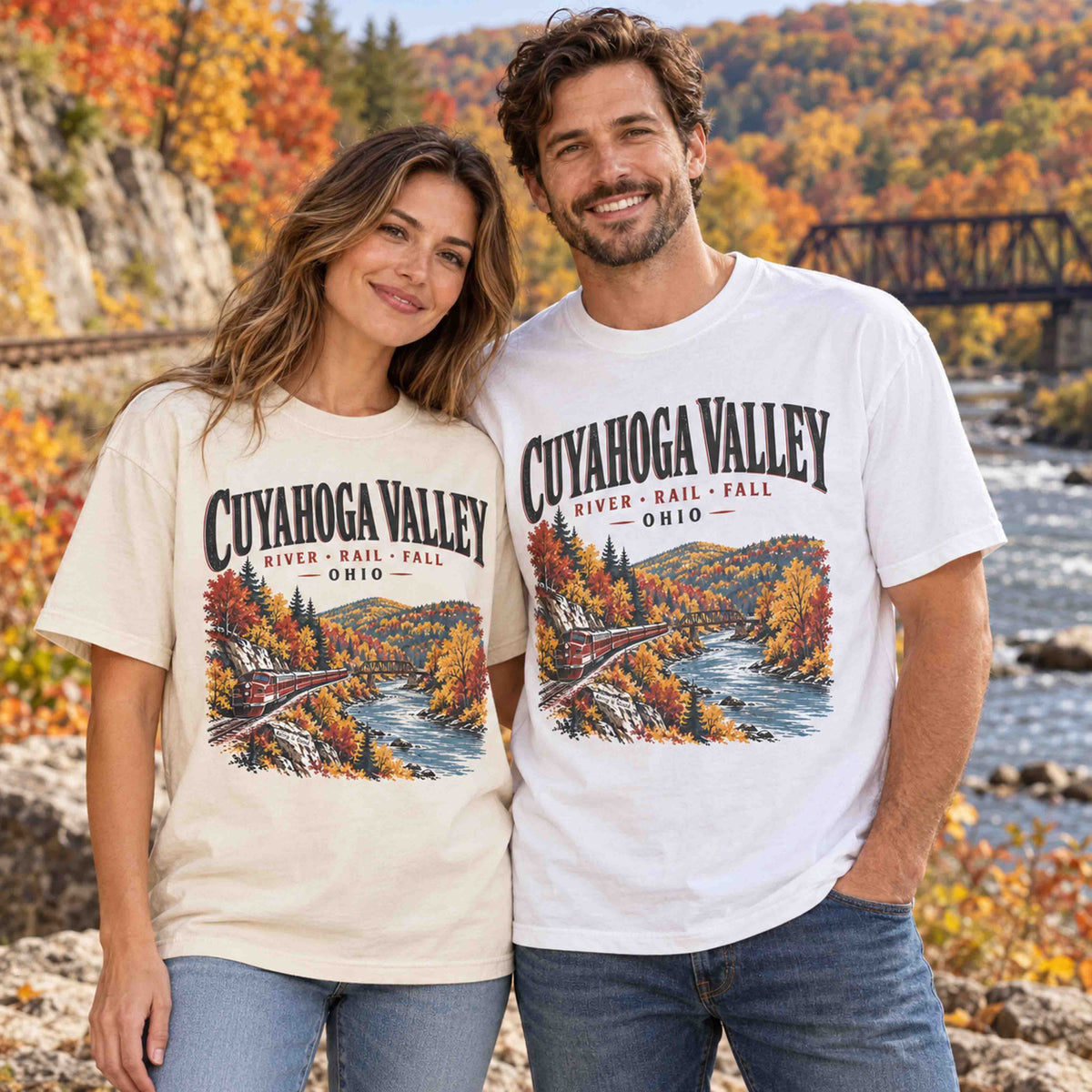 Cuyahoga Valley River Rail Fall graphic tees in Ivory and White worn by a couple in an autumn Ohio landscape