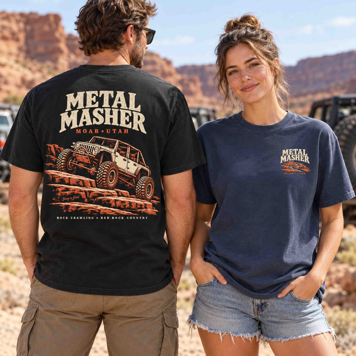 Couple wearing Being is Good Metal Masher tees, showing the Black rock-crawling back graphic and Navy left-chest print.