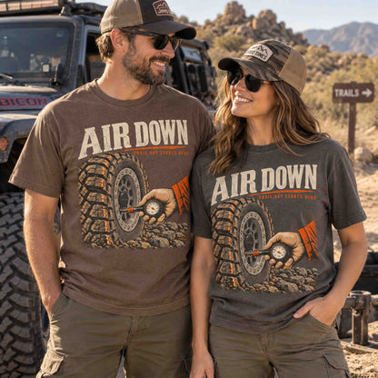 Air Down off-road graphic tees by Being is Good in Espresso and Pepper, worn by a couple on a desert trail