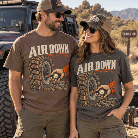 Air Down off-road graphic tees by Being is Good in Espresso and Pepper, worn by a couple on a desert trail
