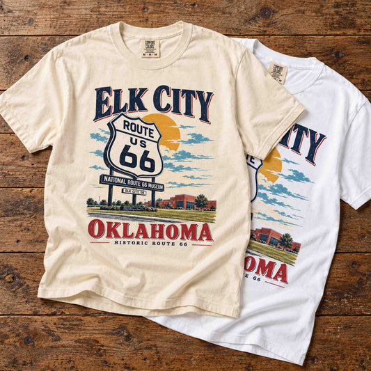 Being is Good Elk City Oklahoma Route 66 graphic T-shirts shown in Ivory and White.