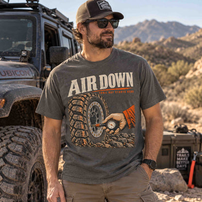 Air Down graphic tee by Being is Good in Pepper, men's front fit on a desert trail