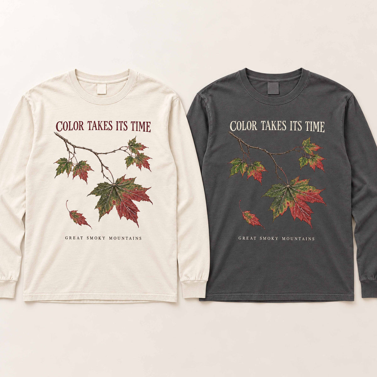 Ivory and Pepper Smoky Mountains maple leaf long sleeve shirts laid flat side by side.