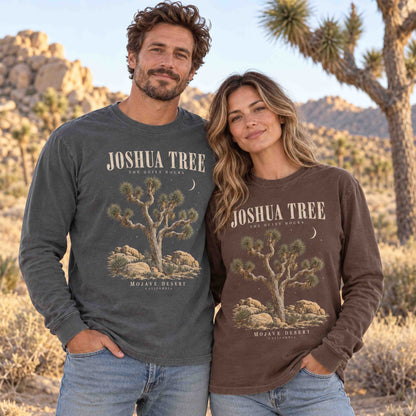 Couple wearing Pepper and Espresso Joshua Tree The Quiet Hours long sleeve shirts, with Joshua trees and desert boulders in the background.
