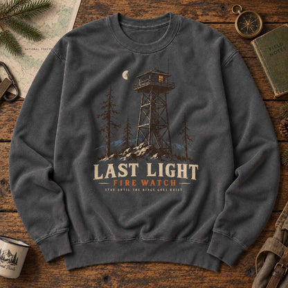 Last Light Fire Watch graphic sweatshirt flat lay featuring vintage mountain lookout artwork