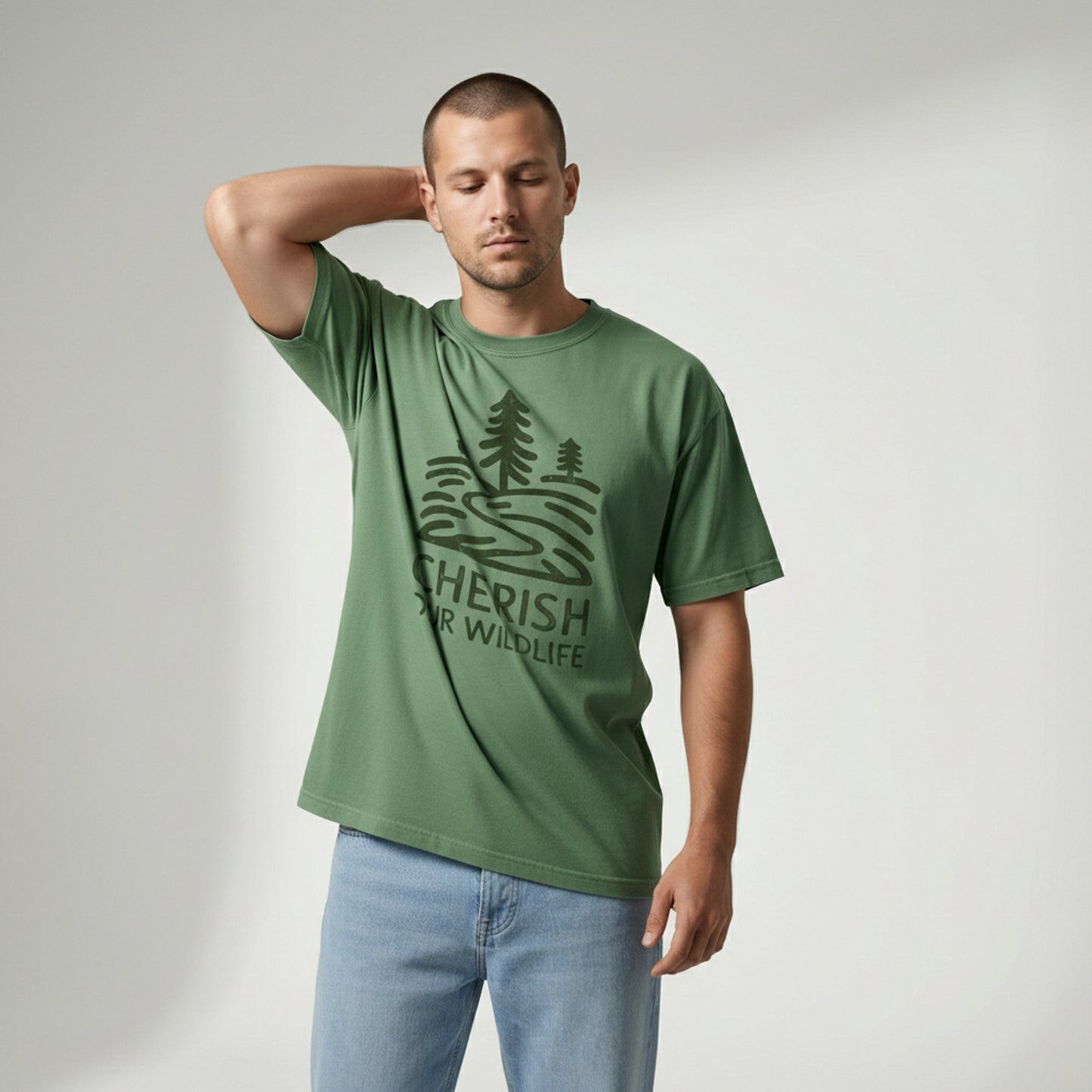 Man standing with his hand behind his neck, modeling a green vintage-style woods t-shirt.