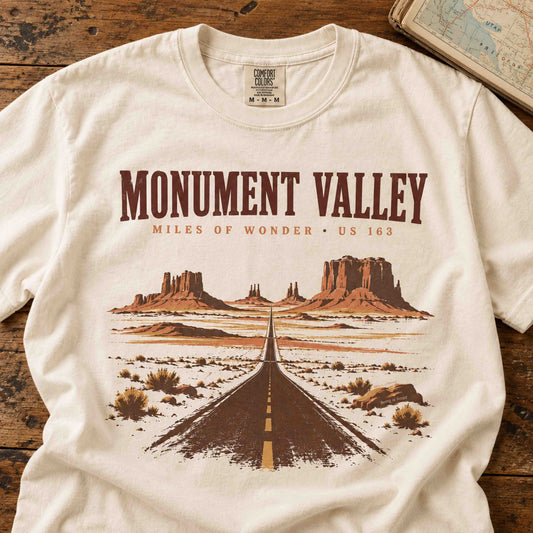 Close-up of Monument Valley Miles of Wonder vintage graphic t-shirt featuring a desert highway and sandstone formations.