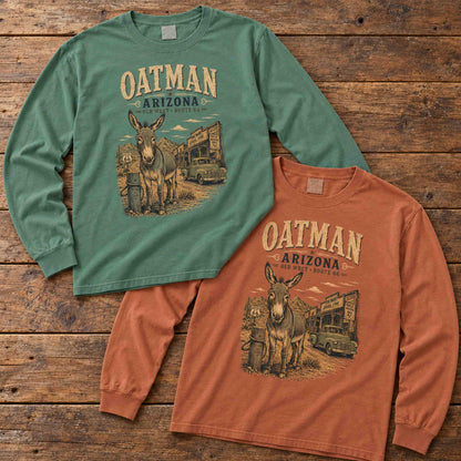 Light Green and Yam Oatman Route 66 long sleeve tees arranged flat on wood, showing both color options.