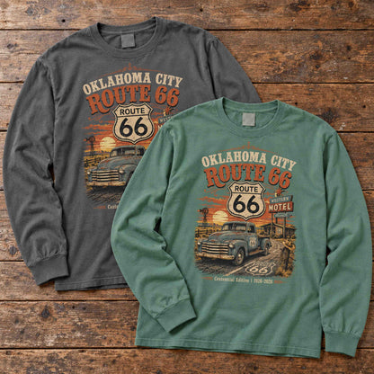 Pepper and Light Green Oklahoma City Route 66 long sleeve graphic tees arranged flat on a wooden table.