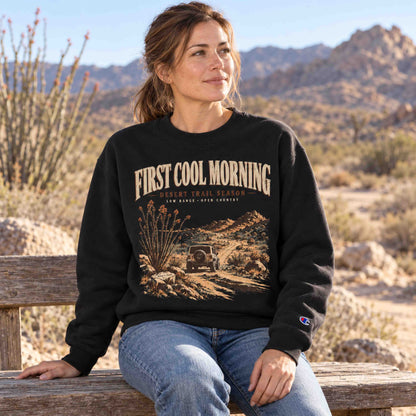 Woman wearing a Dark Green Champion First Cool Morning Desert Trail graphic sweatshirt on a quiet desert morning
