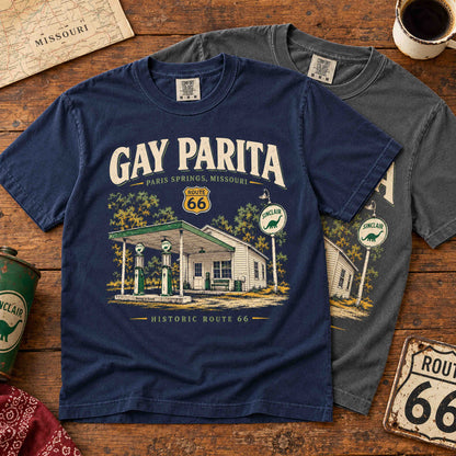 Navy and Pepper Gay Parita Paris Springs Route 66 graphic T-shirts overlapping on a rustic wooden table.